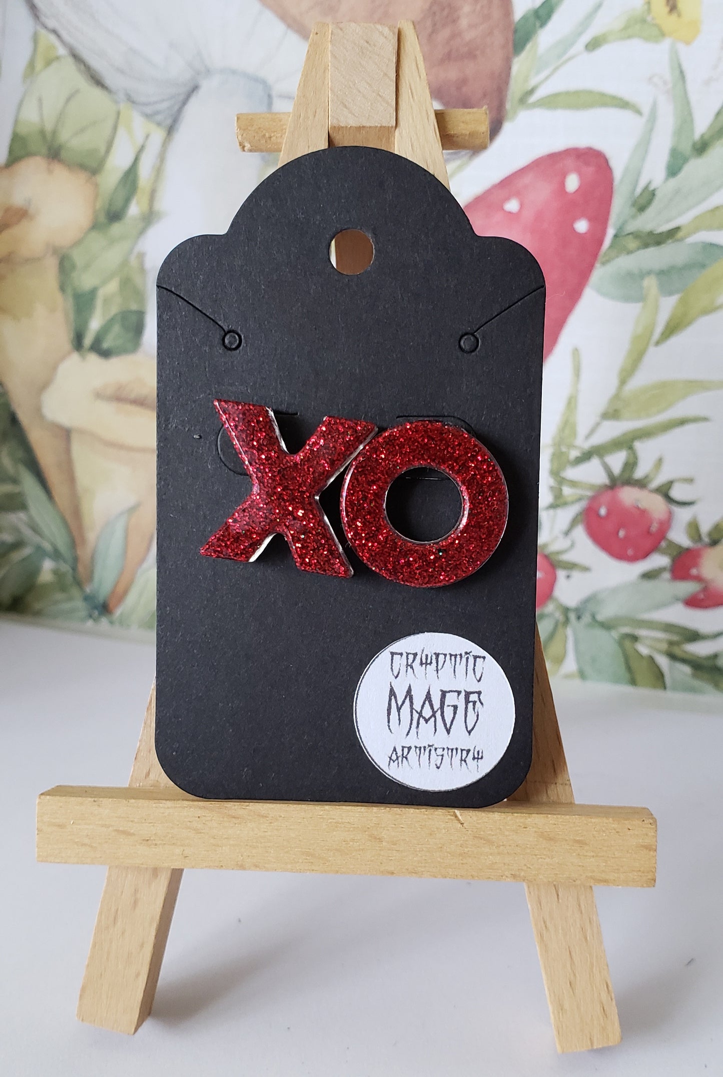 Hugs and kisses? Ex's and Oh's? Red glitter earrings.